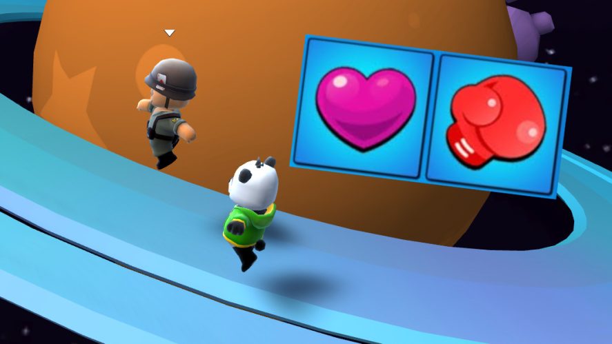Two players of Stumble Guys and the grab and hit icons on the screen