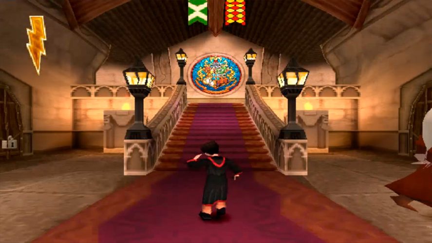 Harry Potter and the Philosopher's Stone in-game screenshot showing Harry in front of the stairs to the Hogwarts entrance hall.