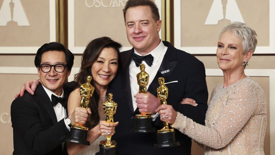 From left to right, Ke Huy Quan, Michelle Yeoh, Brendan Fraser and Jamie Lee Curtis posing together with their corresponding Oscars.