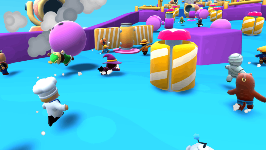 Stumble Guys: Several characters running and jumping through an obstacle circuit.