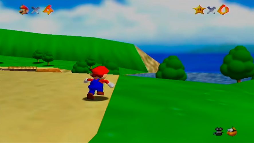 Super Mario 64 in-game screenshot showing Mario running in a green meadow